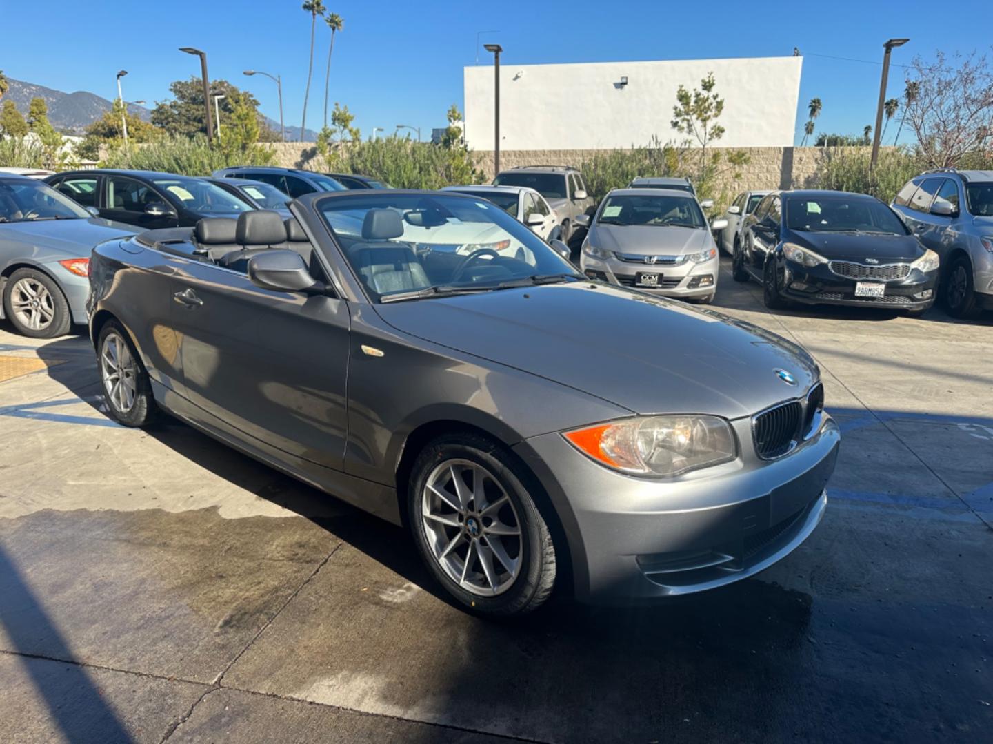 2011 Gray /Black BMW 1-Series 128i Convertible (WBAUN1C52BV) with an 3.0L L6 DOHC 24V engine, Automatic transmission, located at 30 S. Berkeley Avenue, Pasadena, CA, 91107, (626) 248-7567, 34.145447, -118.109398 - Low Miles!!! Elevate your driving experience with our 2011 BMW 1-Series 128i Convertible, now featured at our Buy Here Pay Here (BHPH) dealership in Pasadena, CA. Ideal for enthusiasts in Altadena CA, Glendale CA, Los Angeles CA, and throughout LA County, this stunning pre-owned convertible combine - Photo#11